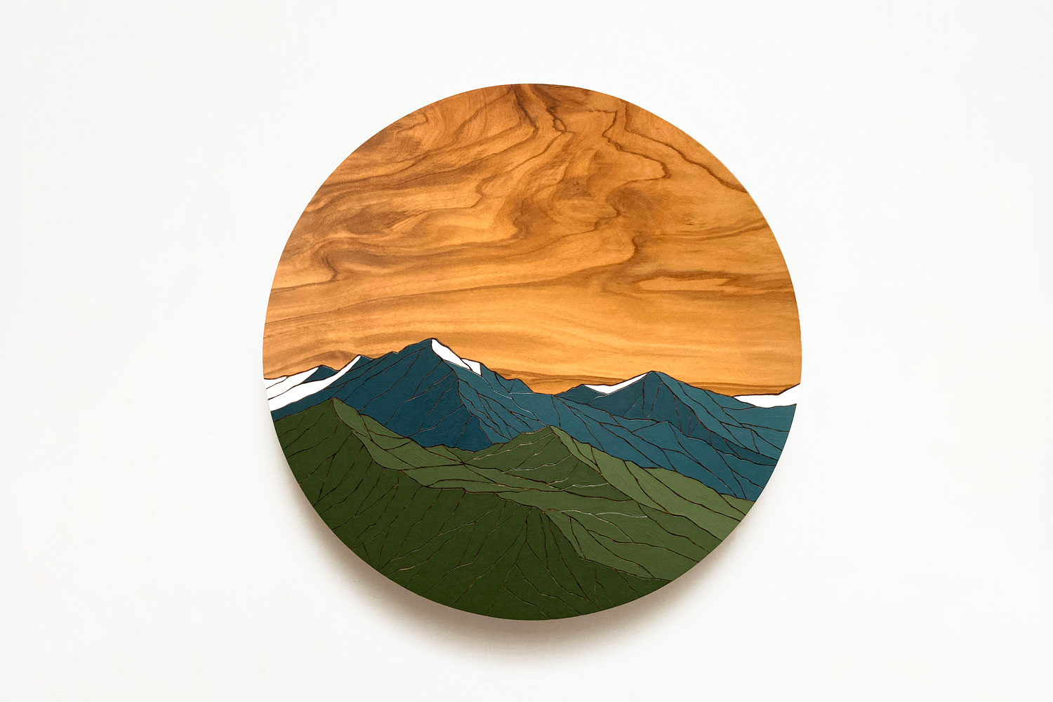 Clare & Josh Dalby Green and blue mountains circle